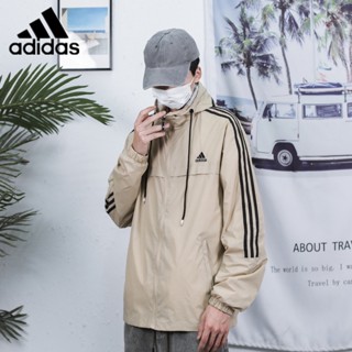 เสื้อแจ็กเก็ตกันลม มีฮู้ด ปักลายโลโก้ Adidas แบบดั้งเดิม เหมาะกับใส่กลางแจ้ง สไตล์สปอร์ต แฟชั่นคู่รัก