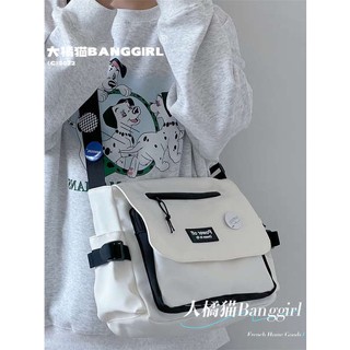 สามารถใส่กระเป๋าแท็บเล็ต กระเป๋าใส่ไอแพด INS College Student Crossbody Bag Class กระเป๋าเป้สะพายหลังลําลองกระเป๋าสะพายไหล่กระเป๋าญี่ปุ่นหญิงฮาราจูกุวินเทจบุรุษไปรษณีย์กระเป๋าผู้ชาย