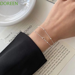 Doreen สร้อยข้อมือโซ่ โลหะผสมไทเทเนียม สองชั้น จี้รูปหัวใจกลวง ประดับเพชรเทียม สําหรับผู้หญิง