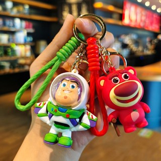 พวงกุญแจซิลิโคน จี้การ์ตูน Toy Story Strawberry Bear Three-Eyed Monster ขนาดเล็ก เหมาะกับของขวัญวันหยุด สําหรับห้อยกระเป๋านักเรียน รถยนต์