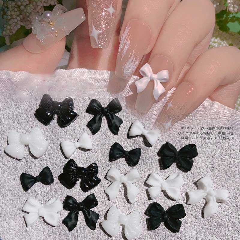 โบว์เรซิ่นน่ารัก สีดํา สีขาว อุปกรณ์เสริมสําหรับตกแต่งเล็บ ทําเอง 50 ชิ้นต่อแพ็ค