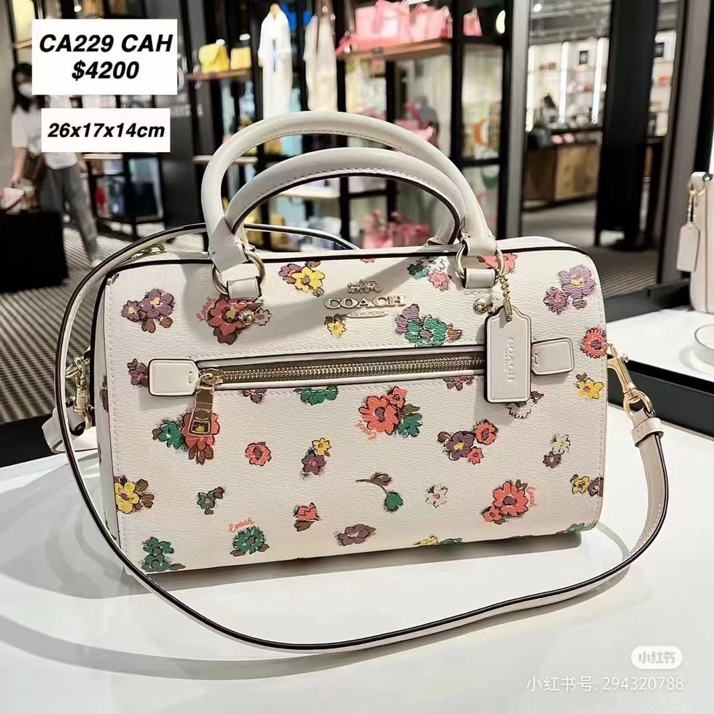 COACH CA229 Rowan กระเป๋าสะพายผู้หญิง/กระเป๋าบอสตัน/ขนาดใหญ่/ดอกไม้พิมพ์ลาย/กระเป๋าถือ