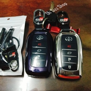 เคสรีโมตกุญแจรถยนต์ Toyota  Legender Revo GR  Rocco  ฝาหน้าปุ่มใสและหลังใสเห็นโลโก้ สีม่วงเข้มและเงินเงา พวงกุญแจ GR
