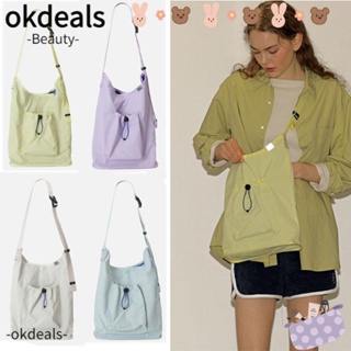 Okdeals กระเป๋าสะพายไหล่ ผ้าไนล่อน ทรงบักเก็ต น้ําหนักเบา สีพื้น สไตล์เรียบง่าย สําหรับผู้หญิง