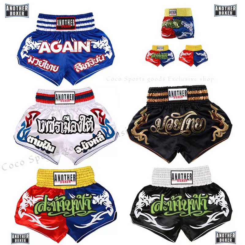 ANOTHERBOXER ใหม่มวยไทยกางเกงขาสั้นแฟชั่นเย็บปักถักร้อยสไตล์มวยกระจัดกระจายต่อสู้กางเกงออกกำลังกายการฝึกอบรมมืออาชีพชายและหญิงการแข่งขันกางเกง