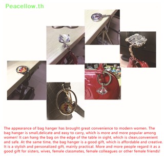 Peacellow ตะขอแขวนกระเป๋าถือ ตุ๊กตา แบบพกพา พับได้ 1 ชิ้น