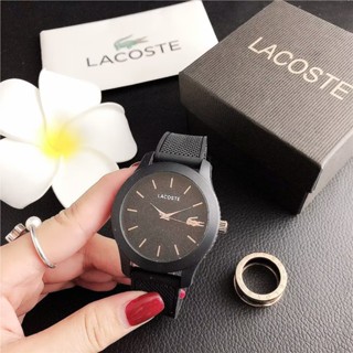 Lacoste นาฬิกาข้อมือควอตซ์ลําลอง สายหนัง หน้าปัดกลม ประดับเพชร เหมาะกับของขวัญวันเกิด สําหรับผู้ชาย และผู้หญิง