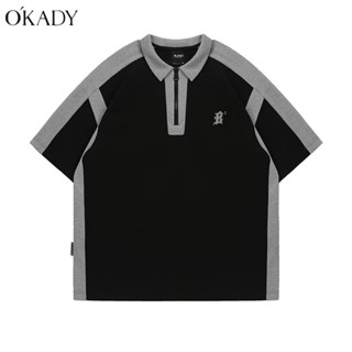 OKADY เสื้อโปโลเยาวชนชายแฟชั่นเรียบง่ายอารมณ์พิมพ์แขนห้าส่วนหลวม