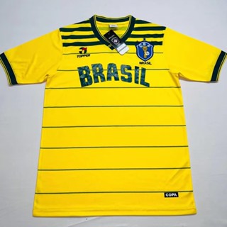 เสื้อกีฬาแขนสั้น ลายทีมชาติฟุตบอล Brazil Cup Home Retro Jersey 1984 แห้งเร็ว ไซซ์ S-XXL สําหรับผู้ชาย AAA