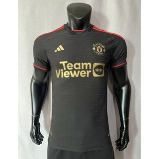 เสื้อกีฬาแขนสั้น ลายทีมฟุตบอล Manchester United 2023-24 ชุดเยือน สีดํา สีทอง