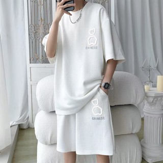 ชุดเสื้อยืดแขนสั้น กางเกงขาสั้น ทรงหลวม ลายหมีเรืองแสง สีพื้น แฟชั่นฤดูร้อน สําหรับผู้ชาย ไซซ์ M-8XL