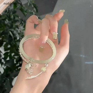 Nf สร้อยข้อมือกําไลข้อมือ ประดับพู่ สีเขียว เรียบง่าย ปรับได้ เครื่องประดับแฟชั่น สไตล์วินเทจ สําหรับผู้หญิง