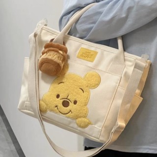 Lovely cartoon Winnie bear canvas satchel honey pot pendant doll portable hand carrying dual-purpose bag