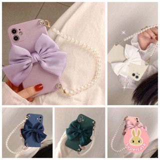 เคสโทรศัพท์มือถือ TPU แบบนิ่ม ลายโบว์น่ารัก พร้อมสายคล้องมือ ประดับไข่มุก สําหรับ Huawei Honor Magic 5 Pro 4 Pro Nova 11 Pro 11 Ultra