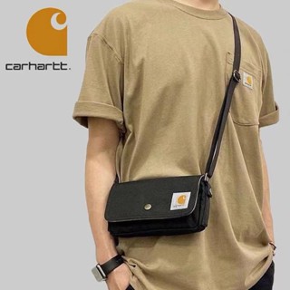 Carhartt กระเป๋าสะพายไหล่ กระเป๋าคลัทช์ ผ้าแคนวาส ขนาดเล็ก สําหรับผู้ชาย และผู้หญิง