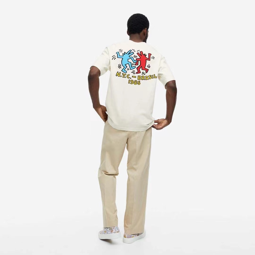 Keith Haring x H&M เสื้อยืดผู้ชายฤดูร้อนใหม่พิมพ์ผ้าฝ้ายแท้ลําลองแขนสั้น