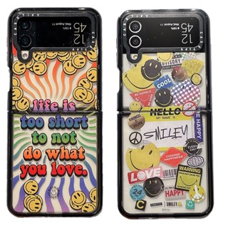 Casetify เคสโทรศัพท์อะคริลิคแข็ง กันกระแทก ลายหน้ายิ้ม สีดํา สําหรับ Samsung Galaxy Z Flip 3 4