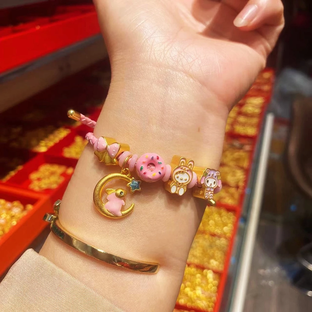 สร้อยข้อมือจี้โดนัทประดับโบว์ สีทองสไตล์จีนโบราณ thumbnail 4