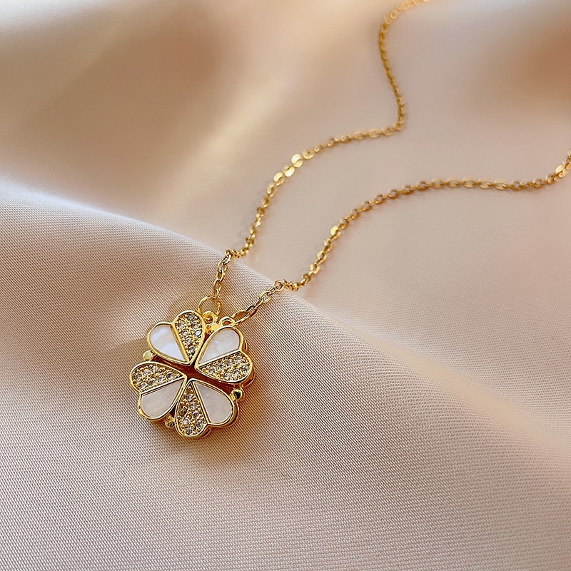 Yinuovo สร้อยคอโคลเวอร์สี่ใบเหล็กไทเทเนียมแม่เหล็กเพชร Studded Shell Love Golden จี้สไตล์ใหม่เปิดและปิดเครื่องประดับโซ่กระดูกไหปลาร้าหลายสวมใส่