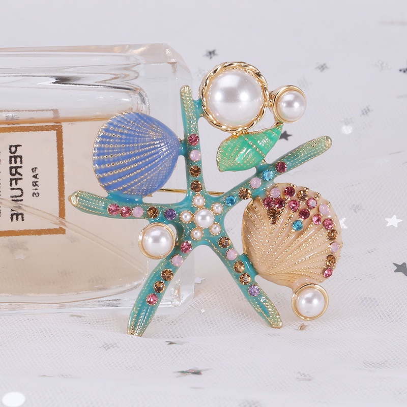 เข็มกลัด รูปดาวทะเล ประดับมุก พลอยเทียม หรูหรา เหมาะกับของขวัญวันหยุด ริมทะเล แฟชั่นสําหรับผู้หญิง และผู้ชาย - รูปที่ 5