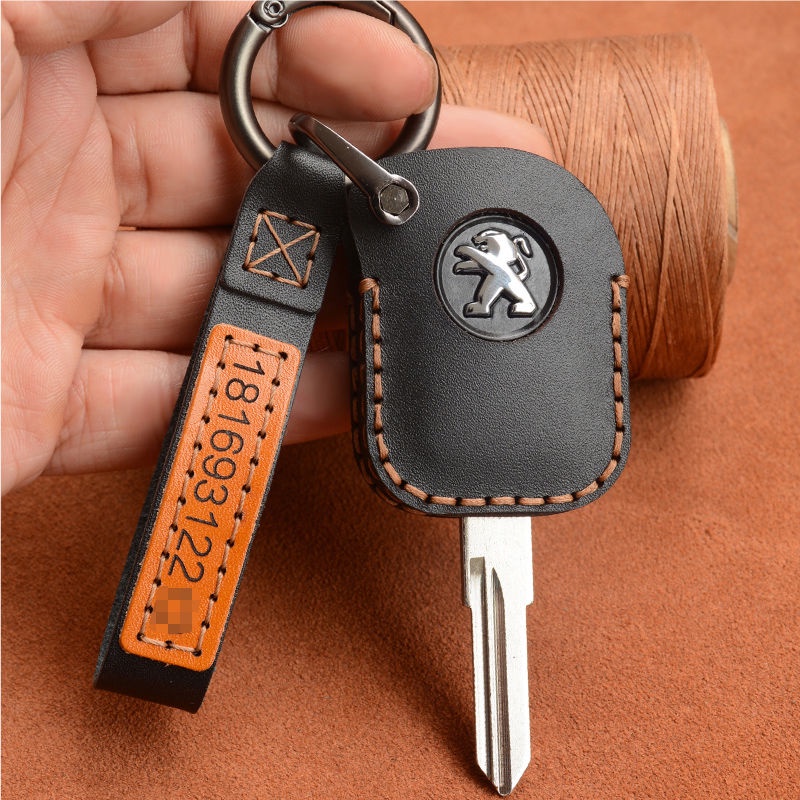 เหมาะสําหรับโลโก้ Django Django ฝาครอบกุญแจ Peugeot Django Django 150 รถจักรยานยนต์ Cowhide Handmade