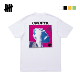 UNDEFEATED ห้าแท่งผู้ชายและผู้หญิงฤดูใบไม้ผลิและฤดูร้อนแบรนด์น้ำแบรนด์ยอดนิยมรูปแบบฟุตบอลพิมพ์เสื้อยืดแขนสั้น2023