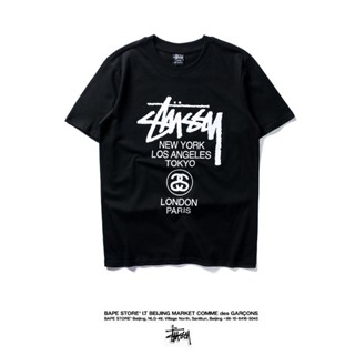 [S-5XL]STUSSY เสื้อยืดแขนสั้นลําลอง ผ้าฝ้าย พิมพ์ลายทัวร์โลก เข้ากับทุกการแต่งกาย สไตล์สตรีท แฟชั่นสําหรับผู้ชาย และผู้ห