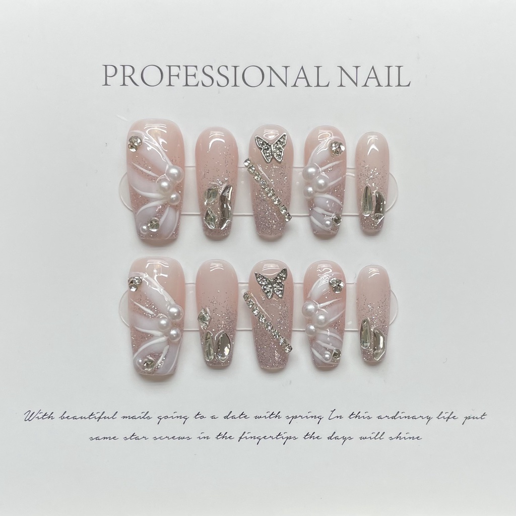 HANDMADEArtificial Nail กระพริบ Starry 3D ผีเสื้อริบบิ้นสีนู้ด Pearl Chain Princess เล็บส่องไฟอ่อนโยน เล็บนํากลับมาใช้ใหม่และถอดได้
