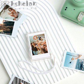 Hshelan กล่องเก็บของ แบบพกพา พร้อมสายคล้องกล้อง สําหรับ Fujifilm Instax Mini 12 11 9 8 7