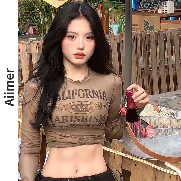 เสื้อยืดแขนยาว พิมพ์ลายตัวอักษร สีโปร่งใส สไตล์อเมริกัน แฟชั่นฤดูใบไม้ผลิ สําหรับผู้หญิง
