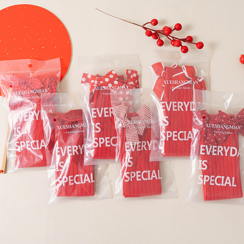 เด็กถุงเท้าหญิงโลลิต้าปีใหม่สีแดงหลอดยาวเทศกาลโบว์ลูกวัว