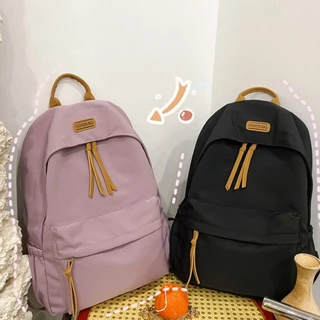 กระเป๋าเป้สะพายหลังสําหรับเดินทางแบบสบาย ๆ อินเทรนด์ใหม่สําหรับผู้หญิงสีทึบดีไซน์เรียบง่ายสําหรับนักเรียนความจุขนาดใหญ่อเนกประสงค์แ