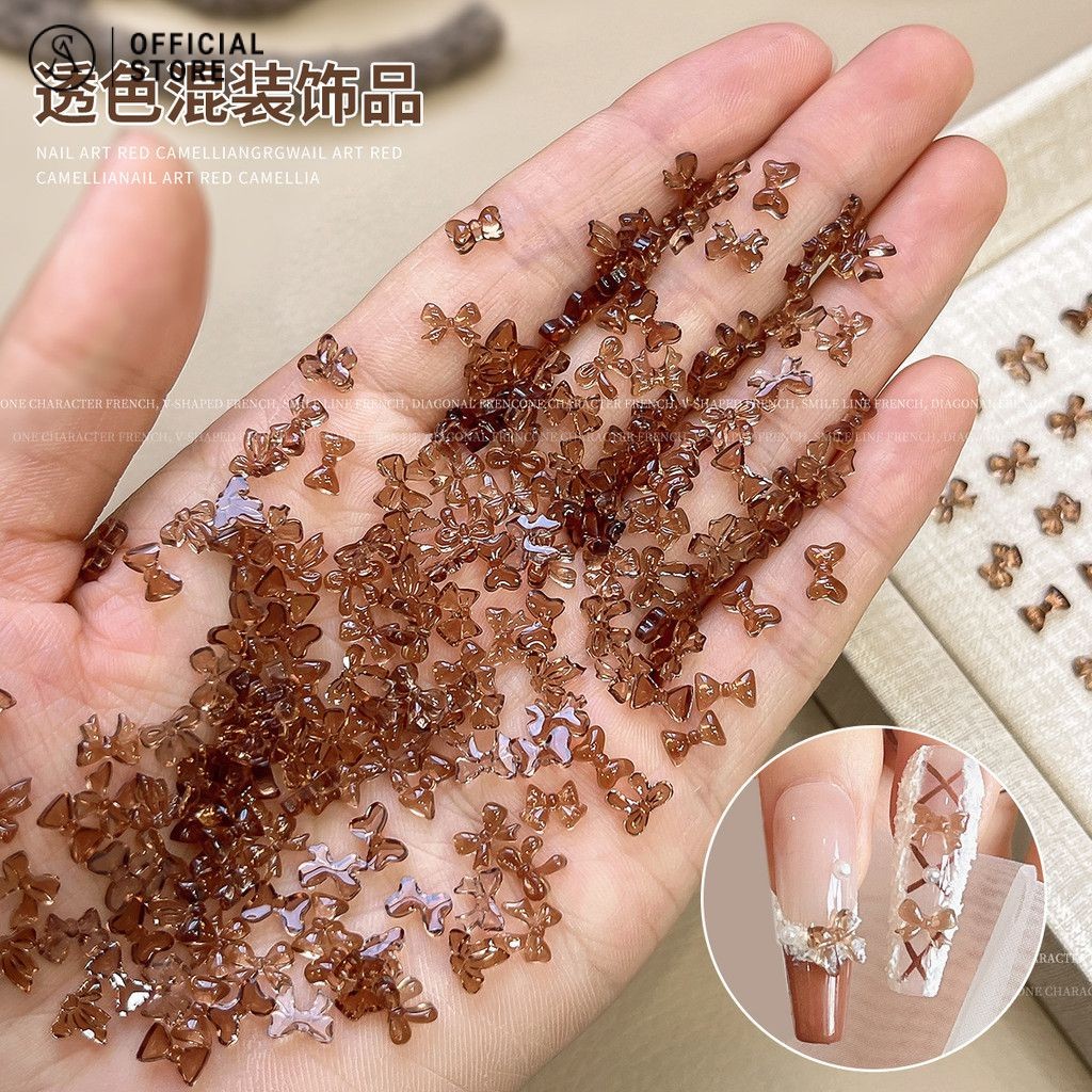โบว์ขนาดเล็ก เครื่องประดับสว่านเล็บ 100 ชิ้น โบว์ผสมสีโปร่งใส อุปกรณ์ตกแต่งเล็บ
