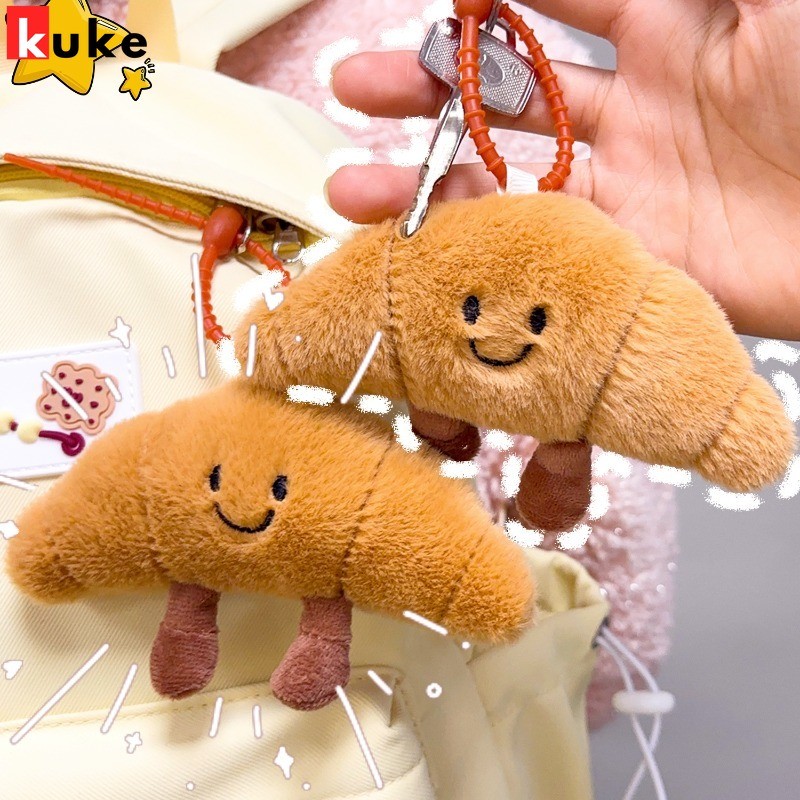 น่ารักครัวซองต์ตุ๊กตาจี้-กระเป๋าแขวนเครื่องประดับ-น่ารัก กระเป๋าเป้สะพายหลังจี้-อาหารรูปร่างขนยาวตุ๊กตาพวงกุญแจ-น่ารักการ์ตูนพวงกุญแจ-ปุยขนมปังตุ๊กตาของเล่นของข