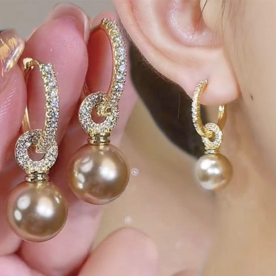 ที่ไม่ซ้ํากัน พลอยเทียม แชมเปญมุกสไตล์ใหม่ที่ดีงามหูหัวเข็มขัดที่สวยหรูระดับไฮเอนด์แสงหรูหราต่างหู