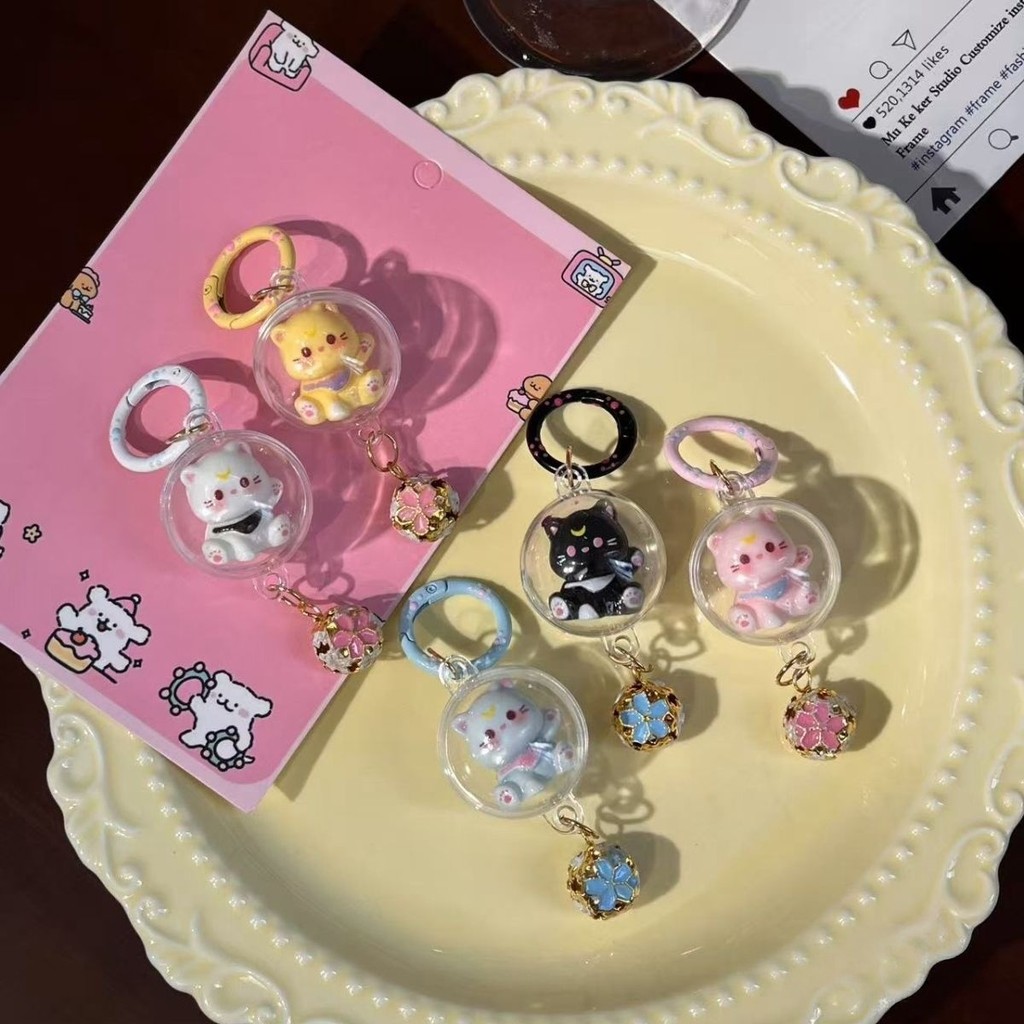 น่ารัก 3D ลูกบอลพลาสติก Cat Key Chains ลูกแมวหวาน Sakura Shape Bell Key แหวนสาวน่ารักกระเป๋าถือเครื่องประดับผู้ถือกุญแจรถ