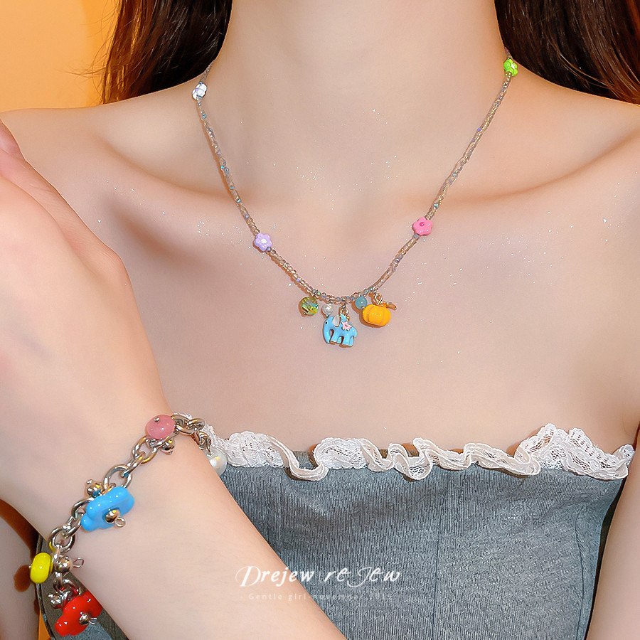 ชุดเครื่องประดับ titanium สีเหลืองทอง พร้อมสร้อยข้อมือ ต่างหู และสร้อยคอมุก