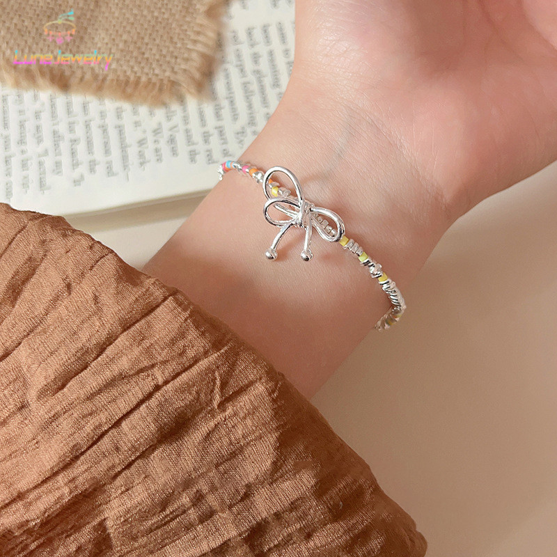 COD💖สร้อยข้อมือ หลากสี ลูกปัด โบว์ แฟชั่น ระดับไฮเอนด์ เรียบง่าย เข้ากับทุกการแต่งกาย ผู้หญิง ของขวัญวันหยุด 2025ใหม่