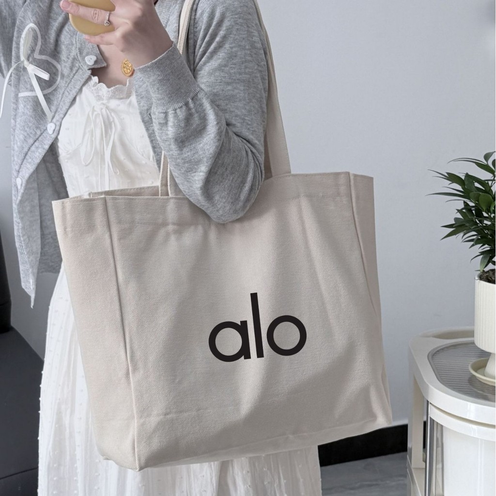 Alo Yoga กระเป๋าผ้าใบไหล่เดียวผู้หญิงกระเป๋าช้อปปิ้งความจุขนาดใหญ่
