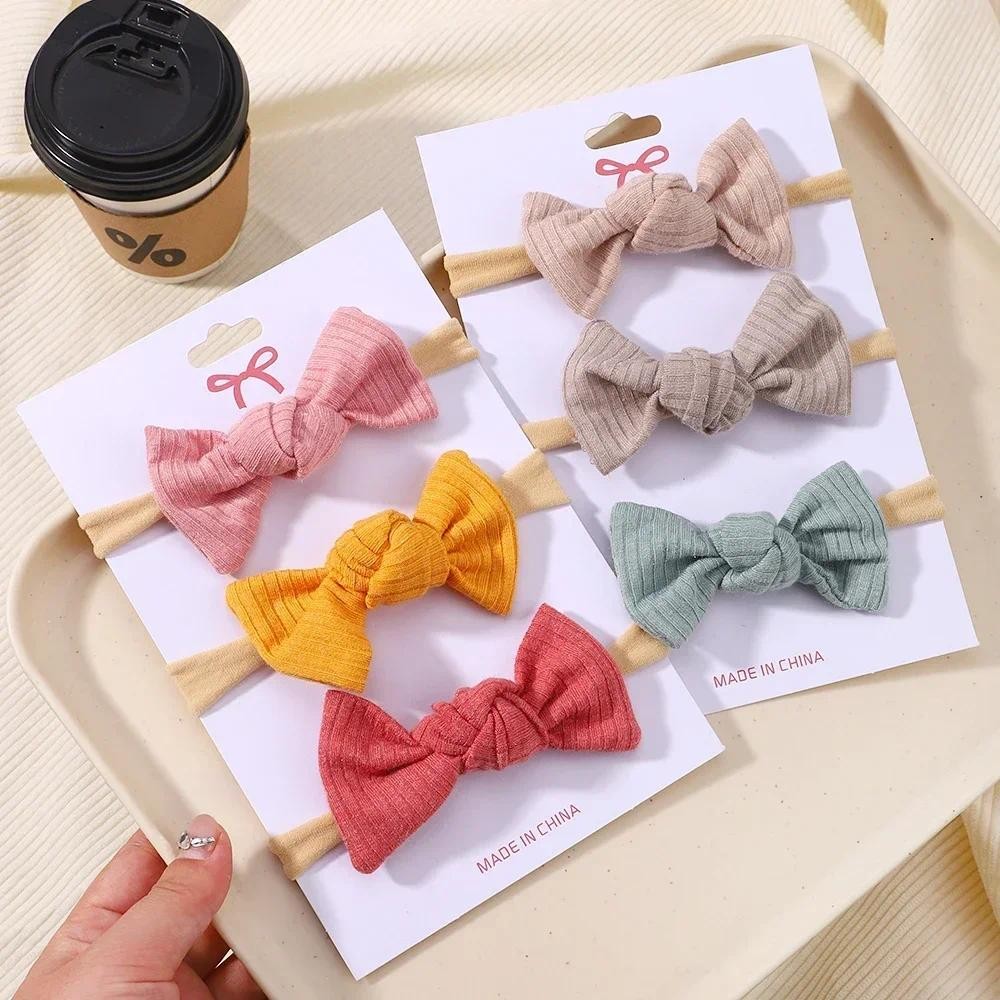 3 ชิ้น/เซ็ต Soft Bows แถบคาดศีรษะสําหรับเด็กทารกไนลอน Hairbands สําหรับทารกแรกเกิดเด็กผม Band Headwear อุปกรณ์เสริมผมขายส่ง