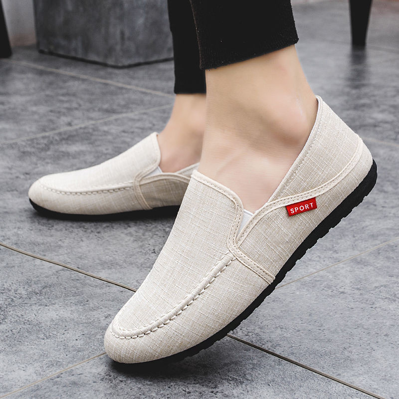 Peas รองเท้าผู้ชายเกาหลีรุ่น Slip-On ขี้เกียจรองเท้าผู้ชายฤดูใบไม้ผลิ Breathable Casual รองเท้าผู้ชายผ้าใบรองเท้า All-Match รองเท้าผ้าใบ