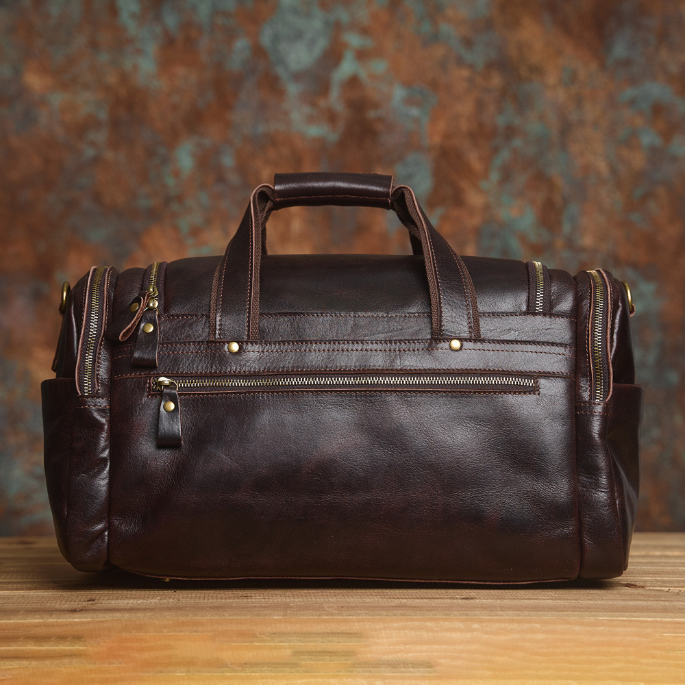 NAVSA หนังแท้ผู้ชาย Retro Duffel กระเป๋าขนาดใหญ่ความจุ First Layer Cowhide กระเป๋าเดินทางระยะทางสั้นแฟชั่นสบายๆ Messen