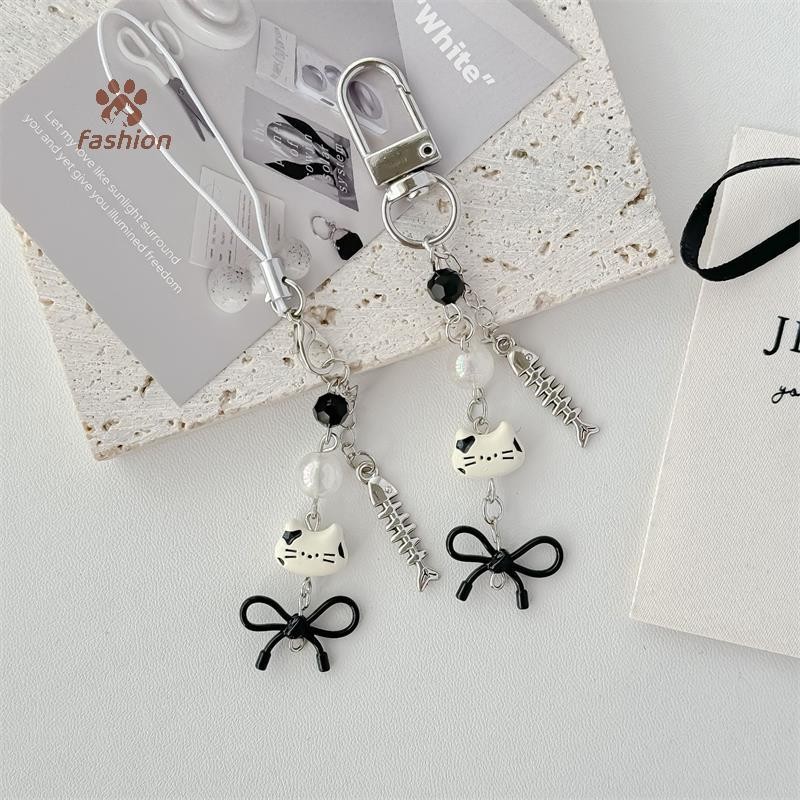 [แฟชั่น] แมวน่ารักปลาโบว์โซ่โทรศัพท์มือถือเชือกเส้นเล็กพวงกุญแจจี้กระเป๋าเป้สะพายหลังแขวนเครื่องประดับอเนกประสงค์แฟชั่นอุปกรณ์เสริมของขวัญ {ไทย}