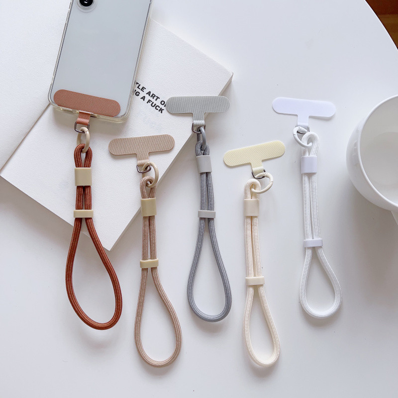 สายคล้องข้อมือโทรศัพท์มือถือแบบปรับได้สีสันสดใสสากลเชือกเส้นเล็กสั้นพร้อมการออกแบบป้องกันการหล่นแบบล็อคตัวเองโพลีเอสเตอร์ที่ทนทาน อิน สายคล้องโ