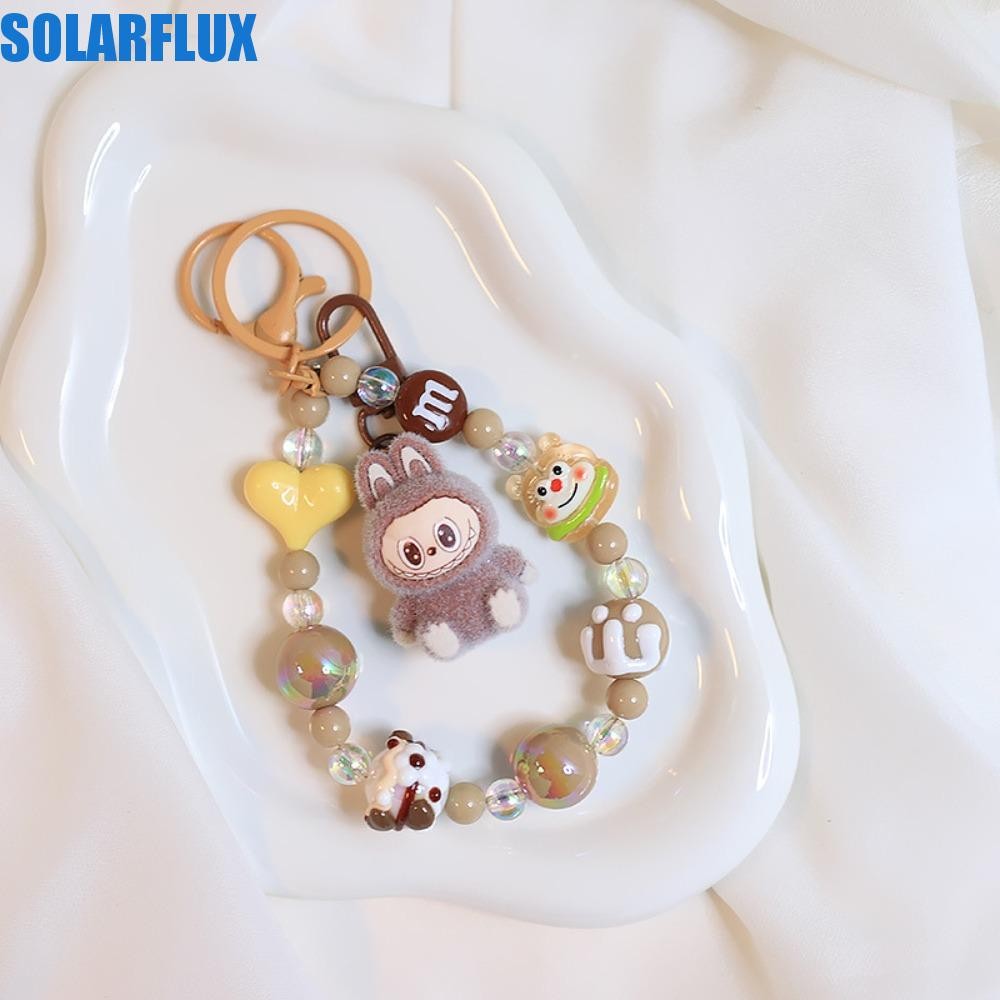 Solarflux Flocking Labubu พวงกุญแจ,ซิลิกาเจล Plush Ball นั่งลง Labubu จี้, ดอกไม้น่ารัก Handmade ลูกปัดตุ๊กตาการ์ตูนพวงกุญแจของขวัญ