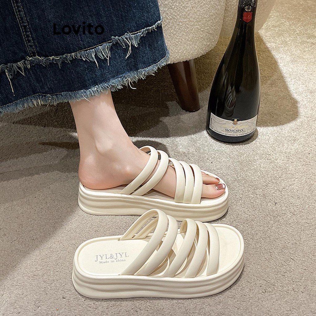 Lovito รองเท้าแตะส้นแบนแบบสวมสบาย ๆ สำหรับผู้หญิงในช่วงฤดูร้อน ด้านนอกมีเข็มขัดคำเดียว สายรัดแบบโรมัน พื้นหนา ด้านนอกมีสายรัดแบบแบนสำหรับนักเรียน LFA59304