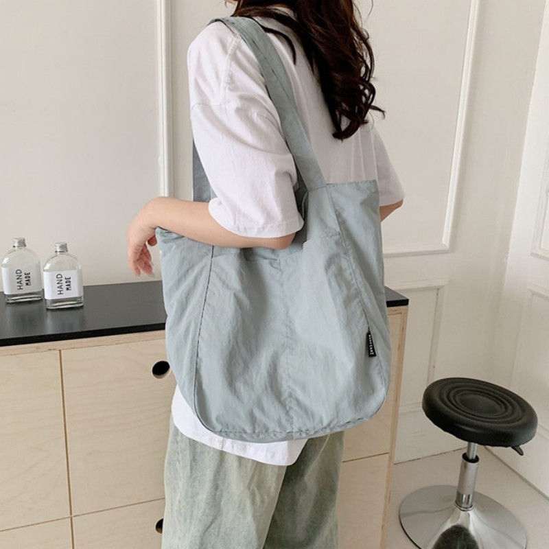 ญี่ปุ่น Minimalist Nylon Crossbody Bag แฟชั่นสไตล์ใหม่ Casual อเนกประสงค์ไหล่ความจุขนาดใหญ่สีทึบอินเทรนด์ Tote