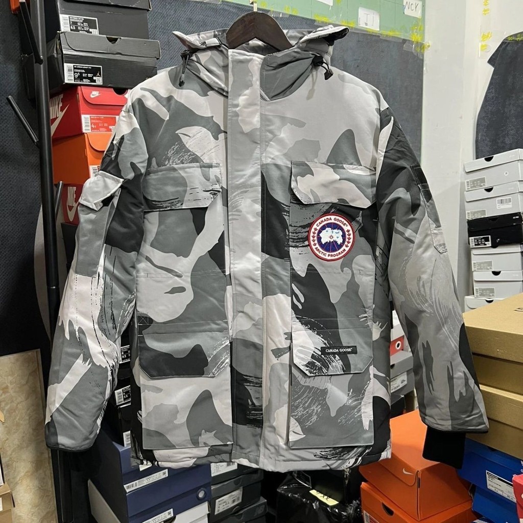 Canada Goose เสื้อแจ็คเก็ตมีฮู้ดผู้ชายผู้หญิงหนาอบอุ่นเสื้อแจ็คเก็ตลายพรางกันลม