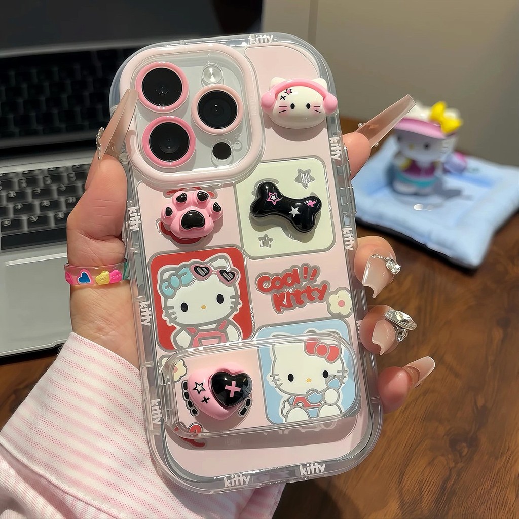 สไตล์ใหม่ 11 ตุ๊กตาสเตอริโอ 12 ชุดหูฟัง Hello Kitty 13 ที่วางกระจก 14 เหมาะสําหรับ Apple 16promax เคสโทรศัพท์ xs การ์ตูน xr น่ารัก iPhone15 กันกระแทกเคส