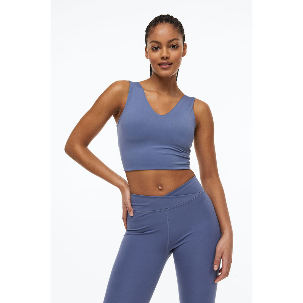 H&M(เอชแอนด์เอ็ม) สปอร์ตบราที่ให้การรองรับปานกลาง ตัดเย็บจากผ้า SoftMove™ Woman SoftMove™ Medium Sup
